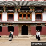 부탄 불교 사찰 방문 에티켓 - **A Serene Entry into a Bhutanese Dzong:** A diverse group of travelers, comprising men and women of...